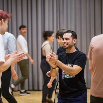 people standing and laughing in a room